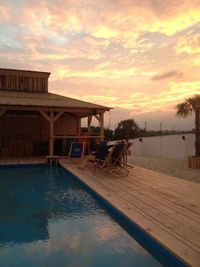 View of swimming pool at sunset