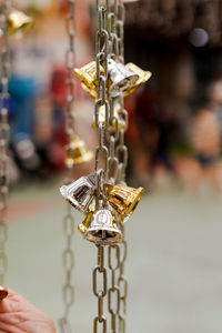 Close-up of decoration hanging for sale in market