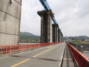 Bridge over road against sky
