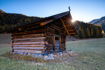 Built structure on field against clear sky