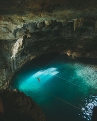 High angle view of woman swimming in sea