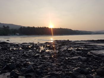 Scenic view of lake against sky during sunset