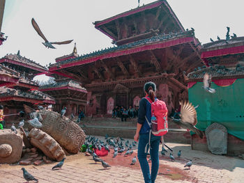 Full length of man outside temple against building