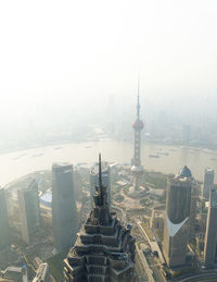 Aerial view of city against clear sky