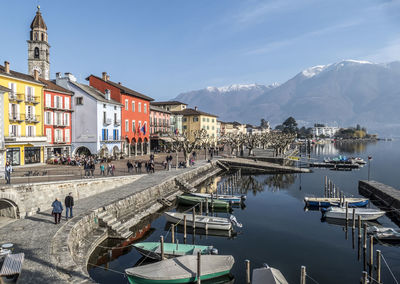 Panorama of ascona with houses with colorful facades reflecting on lake maggiore