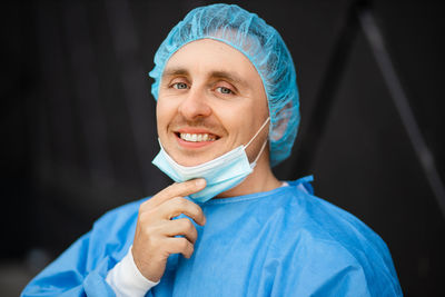 Portrait of smiling doctor wearing mask