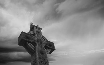 Low angle view of statue against sky