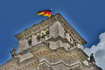 Low angle view of building against blue sky