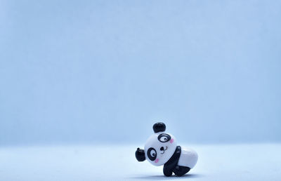Close-up of toy over white background
