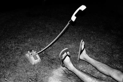 Low section of person holding mobile phone