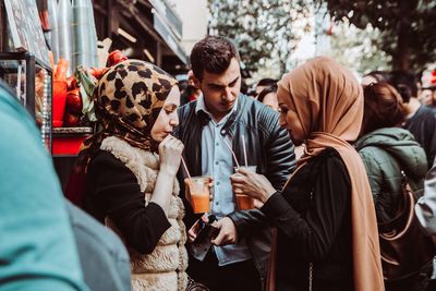 Group of people drinking glass outdoors