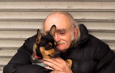 Close-up of man with dog