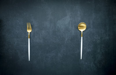 High angle view of wineglass on table against black background