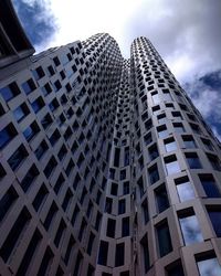 Low angle view of office building against sky