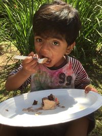 Close-up portrait of boy eating food