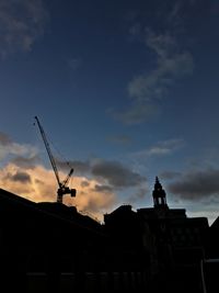 Silhouette of building at sunset