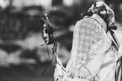 Ancient carnival of sauris. traditional wooden masks. black and white. italy