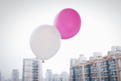 Close-up of balloons against clear sky