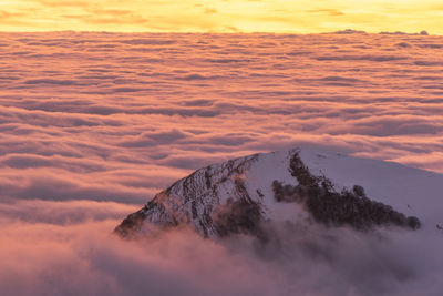 Scenic view of mountain against sky during sunset