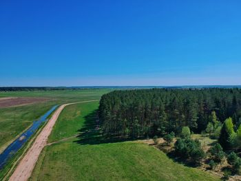 Scenic view of landscape against clear blue sky