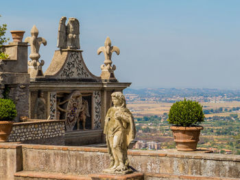 Statue of historic building against clear sky