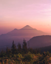 Scenic view of mountains against sky during sunset