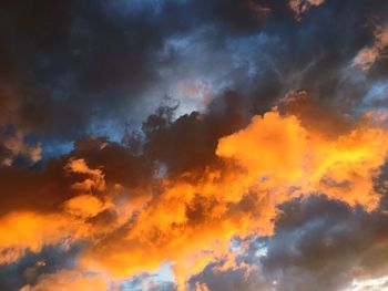 Low angle view of dramatic sky during sunset