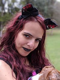 Portrait of woman smiling in park