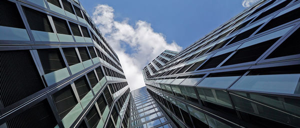 Low angle view of modern buildings against sky