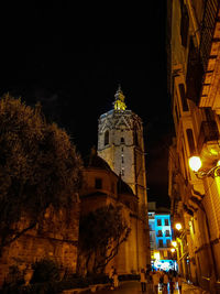 Low angle view of illuminated building at night