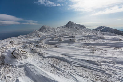 Scenic view of snowcapped mountain against sky