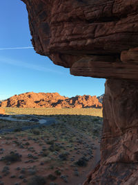 Rock formations on sea shore against sky