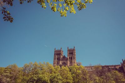 Low angle view of historical building against blue sky