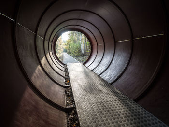 View of round tunnel with footpath at nature park schöneberger südgelände, berlin