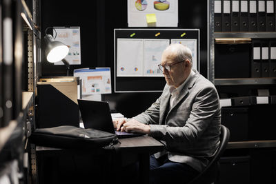 Man using laptop at home