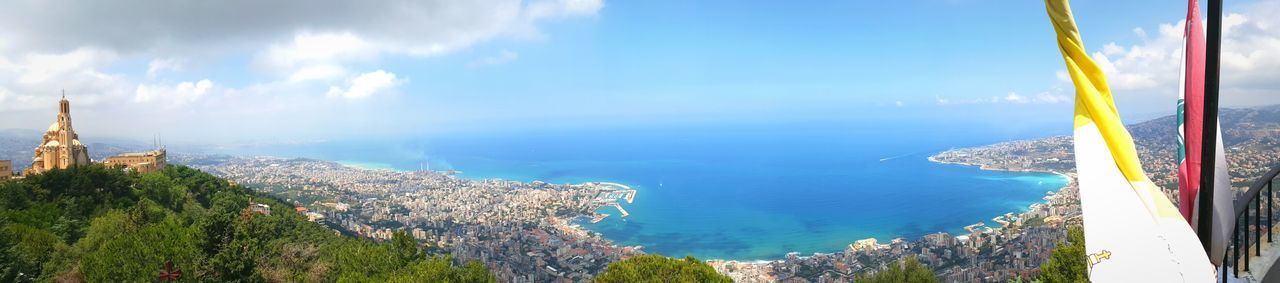 sea, sky, water, blue, horizon over water, scenics, built structure, architecture, panoramic, tree, nature, beauty in nature, building exterior, tranquility, cloud - sky, tranquil scene, high angle view, day, cloud, outdoors