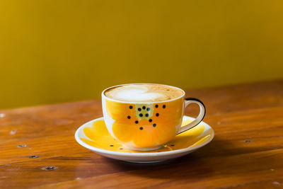 Close-up of coffee cup on table