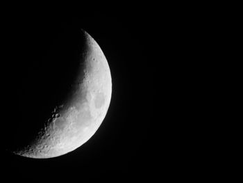 Low angle view of moon against sky at night