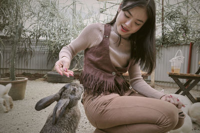 Portrait of young woman using mobile phone