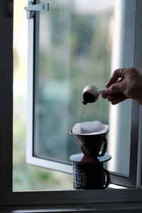 Human hand holding coffee cup