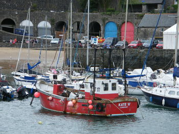 Boats moored in water