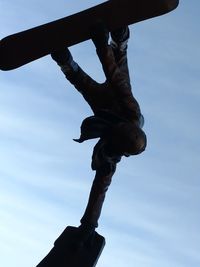 Low angle view of statue against sky