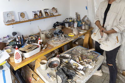 Midsection of man preparing food in kitchen