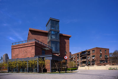 Low angle view of building against blue sky