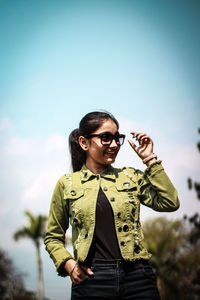 Fashionable woman wearing eyeglasses looking away outdoors