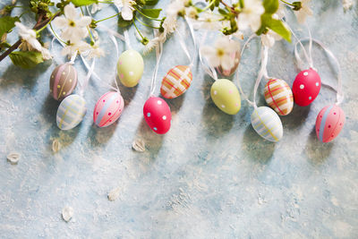 Close-up of multi colored easter eggs on plant