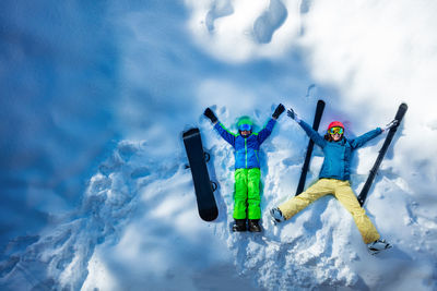 Low angle view of people on snow