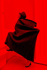 Close-up of red sofa against wall