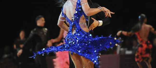 Midsection of dancers performing