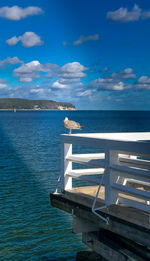 Scenic view of sea against blue sky